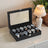 12-Slot Watch Box Organizer - Synthetic Leather - Black with Greenish Grey Lining - Large Glass Lid and Removable Watch Pillows